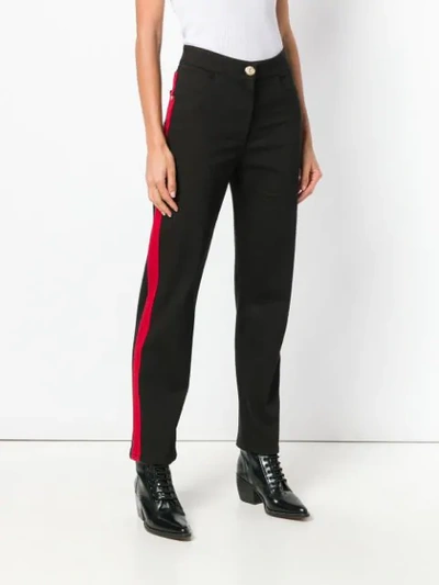 Shop Balmain Side Stripe Trousers In Black