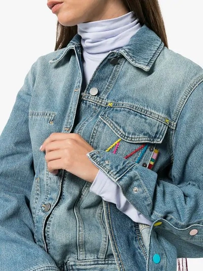 Shop Mira Mikati Oversized Tasselled Cotton Blend Denim Jacket In Light Indigo Wash