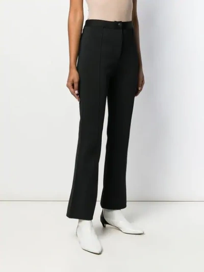 Shop Givenchy Slim Flared Trousers In Black
