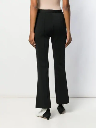 Shop Givenchy Slim Flared Trousers In Black