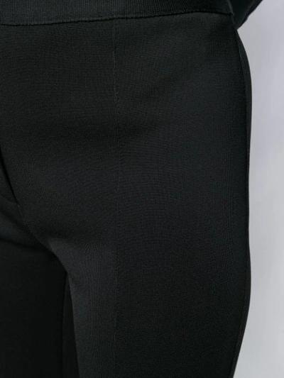 Shop Givenchy Slim Flared Trousers In Black