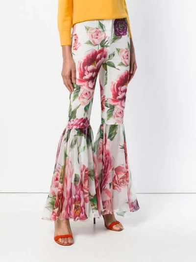Shop Dolce & Gabbana Peony Print Flared Trousers In White