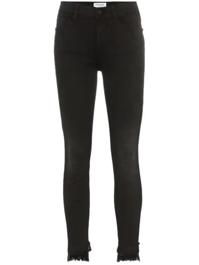 Shop Frame Le High Skinny Raw Stagger Jeans In Black