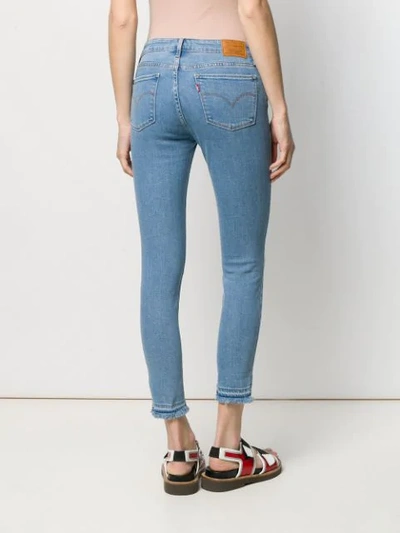 Shop Levi's Frayed Hem Skinny Jeans In Blue