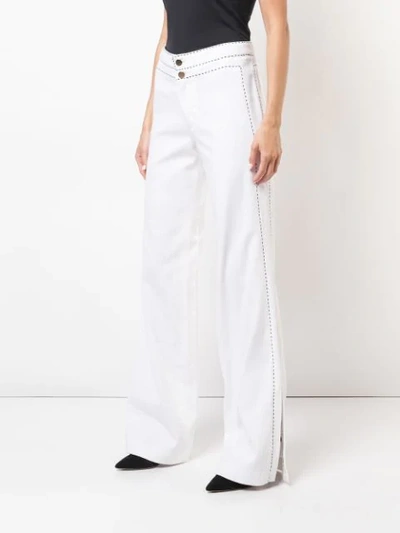 Shop Josie Natori High-waist Flared Jeans In White