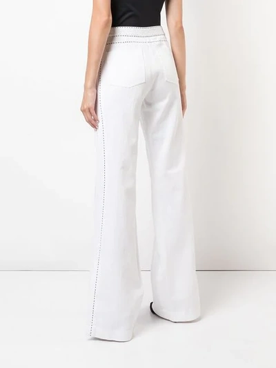 Shop Josie Natori High-waist Flared Jeans In White