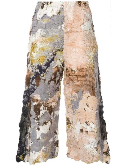 Shop Issey Miyake Cropped Painted Trousers - Neutrals