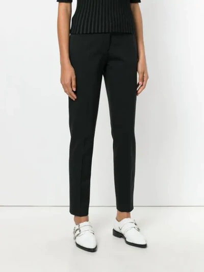 Shop Armani Jeans Slim-fit Trousers - Black