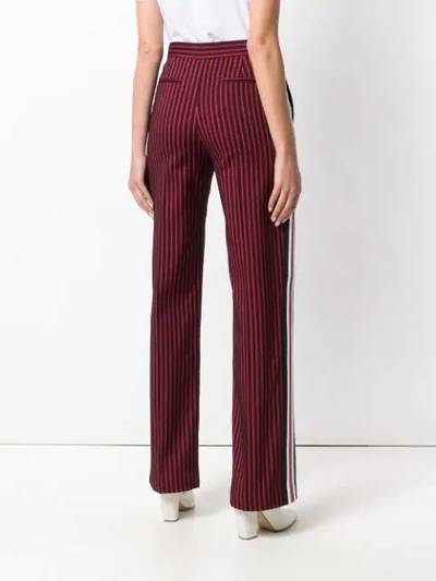 Shop Pinko Striped Flared Trousers In Red