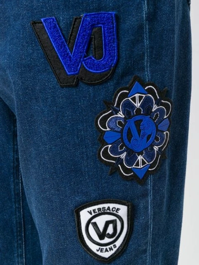 Shop Versace Jeans High Waisted Patch Jeans In Blue