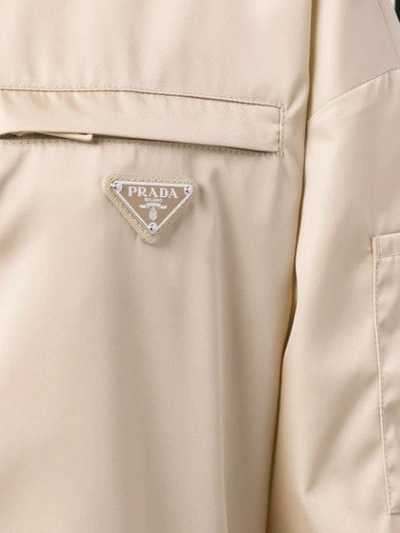 Shop Prada Logo Raincoat In Neutrals