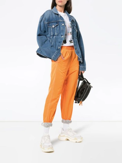Shop Sjyp Logo Waistband Track Pants In Yellow