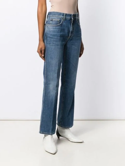 Shop Givenchy Kick Flare Jeans In Blue