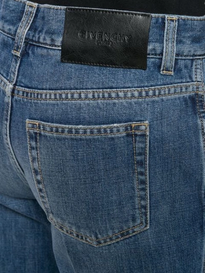Shop Givenchy Kick Flare Jeans In Blue