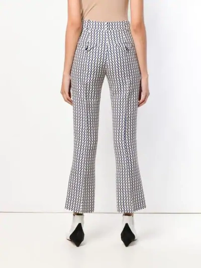 Shop Valentino Logo Print Trousers In Blue