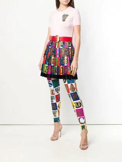 Shop Versace All Over Logo Leggings In A7001 Multicolor