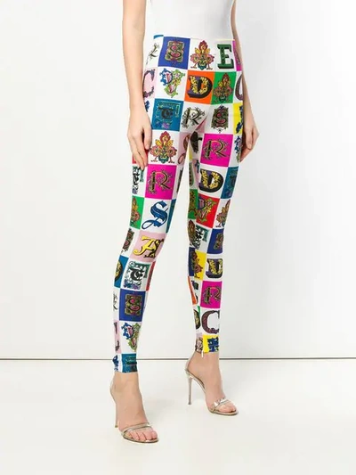 Shop Versace All Over Logo Leggings In A7001 Multicolor