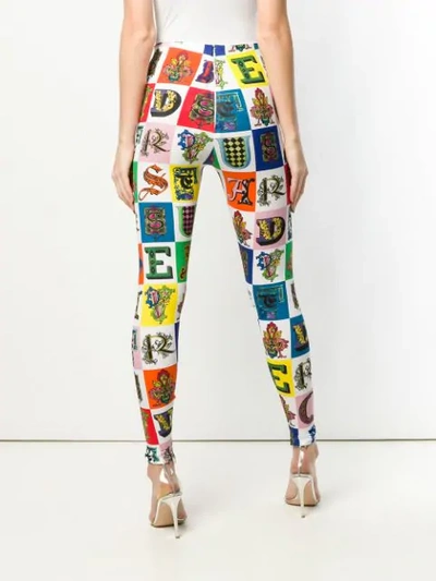 Shop Versace All Over Logo Leggings In A7001 Multicolor