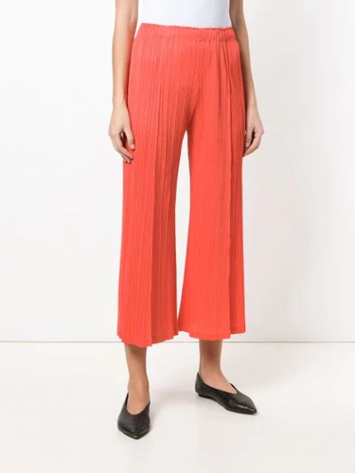 Shop Issey Miyake Plissé Trousers In Red