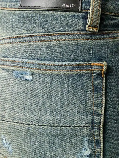 Shop Amiri Washed Skinny Jeans In Blue