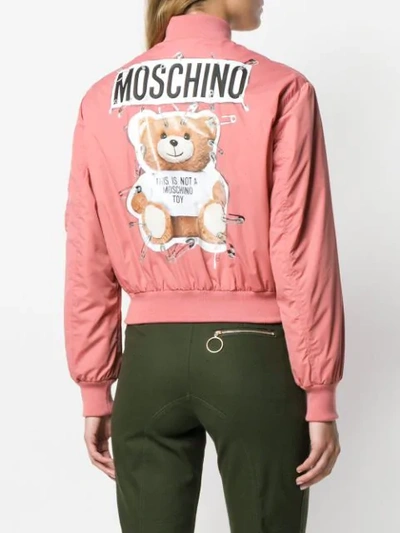 Shop Moschino Zipped Logo Bomber Jacket In Pink