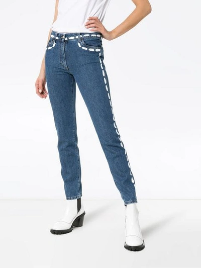 Shop Moschino Low Rise Painted Seam Detail Jeans In Blue