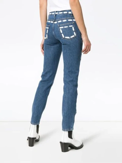 Shop Moschino Low Rise Painted Seam Detail Jeans In Blue