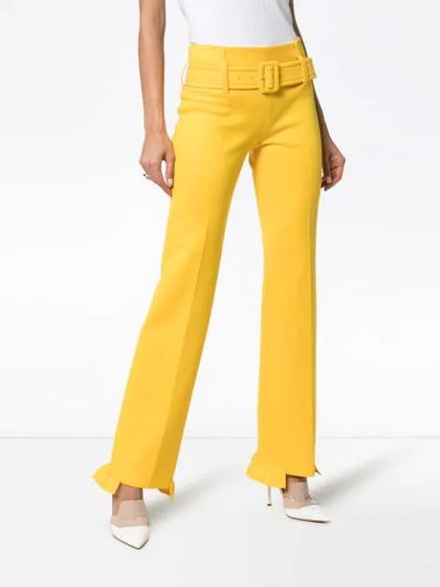 Shop Prada Belted Ruffle Hem Straight Trousers In Yellow