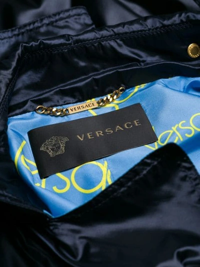 Shop Versace Embellished Trench Coat - Blue