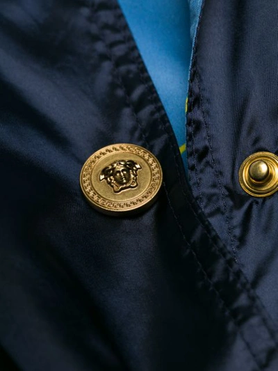 Shop Versace Embellished Trench Coat - Blue