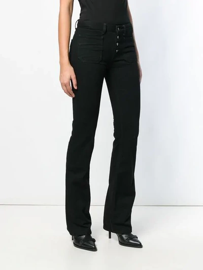 Shop Saint Laurent Schmale Bootcut-jeans In Black