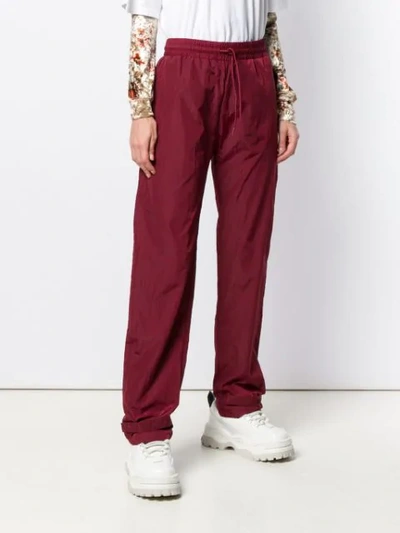 Shop Han Kjobenhavn Touch Strap Ankle Track Trousers In Red