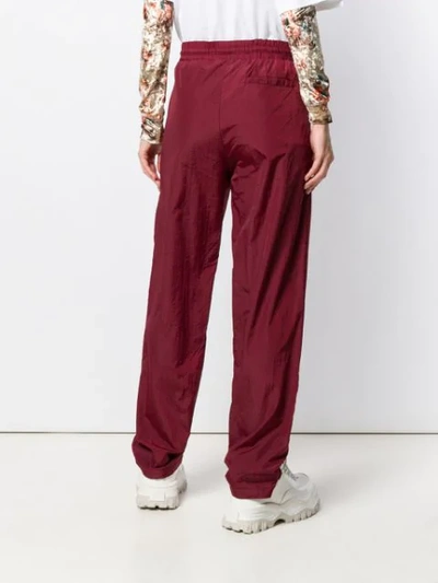 Shop Han Kjobenhavn Touch Strap Ankle Track Trousers In Red