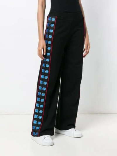 Shop Stella Mccartney Wide Logo Trousers In Black