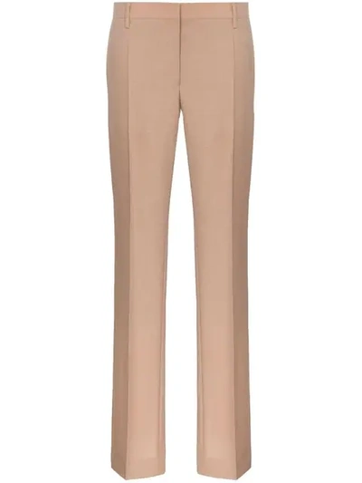 Shop Prada Slim Leg Buttoned Cuff Tailored Woollen Trousers In Neutrals