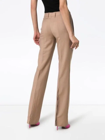 Shop Prada Slim Leg Buttoned Cuff Tailored Woollen Trousers In Neutrals