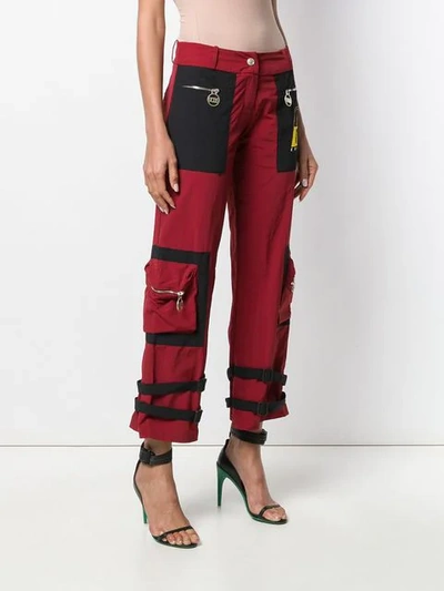 Shop Gcds Buckle Strap Detail Cropped Trousers In Red