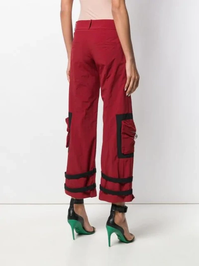 Shop Gcds Buckle Strap Detail Cropped Trousers In Red
