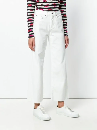 Shop Simon Miller Wide Leg Frayed Jeans In White