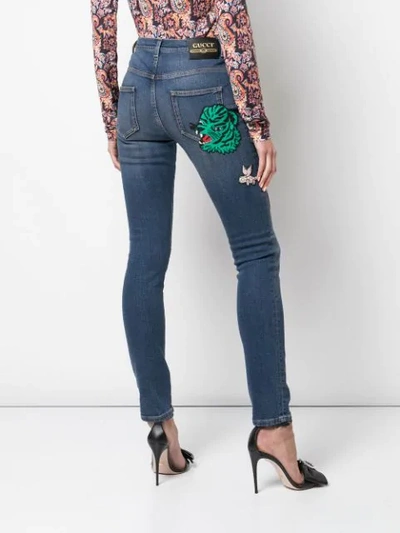 GUCCI PATCHES SKINNY-FIT JEANS - 蓝色