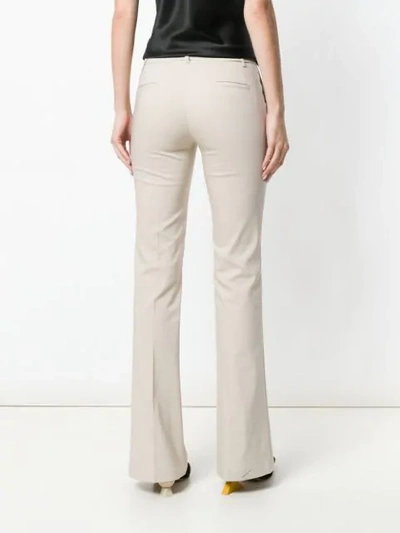 Shop Blanca Flared Mid-rise Trousers In Neutrals