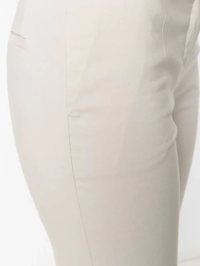 Shop Blanca Flared Mid-rise Trousers In Neutrals