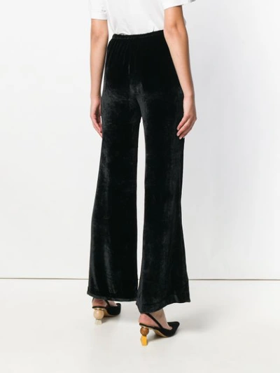 Shop Etro Flared Trousers In Black