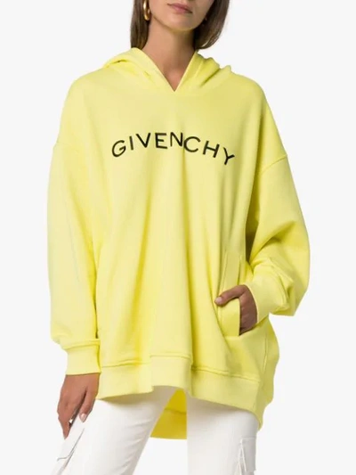 Shop Givenchy Logo Print Hoodie In Yellow