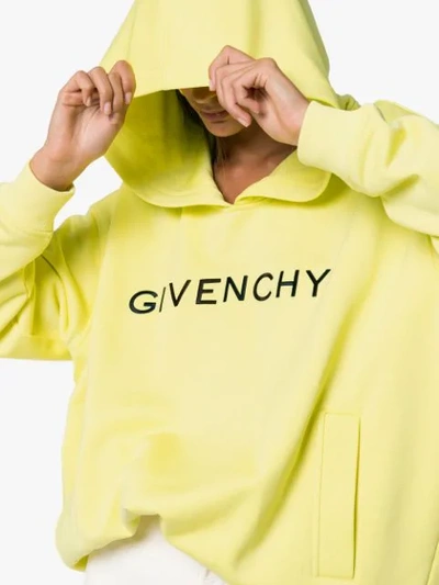 Shop Givenchy Logo Print Hoodie In Yellow
