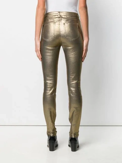 Shop Saint Laurent Skinny Jeans In Gold