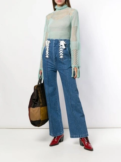 Shop Mame High Waisted Flared Jeans In Blue