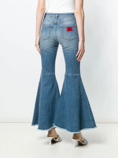 Shop Dolce & Gabbana Flared High Waisted Jeans In Blue