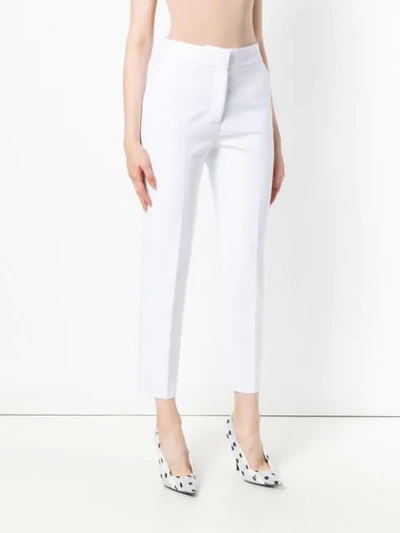 Shop Msgm Cropped Tailored Trousers In White