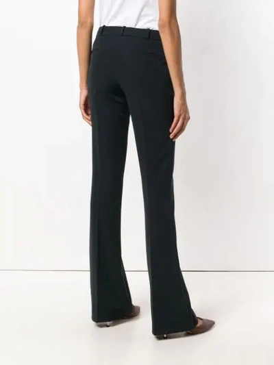 Shop Kiltie Flared Trousers In Black